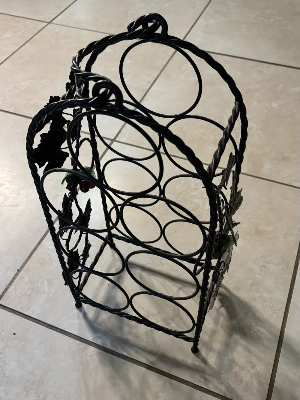 Black Metal Wine Bottle Rack with Decorative Leaf Accents